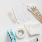 np_Bandages, cotton swabs, sterile gauze, medical tape, and syringe on bright background_49gaW0_free